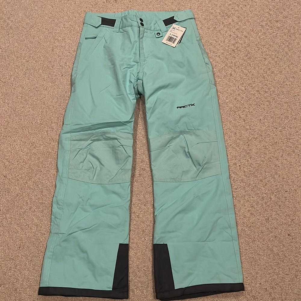 Aqua green kids reinforced snow pants.